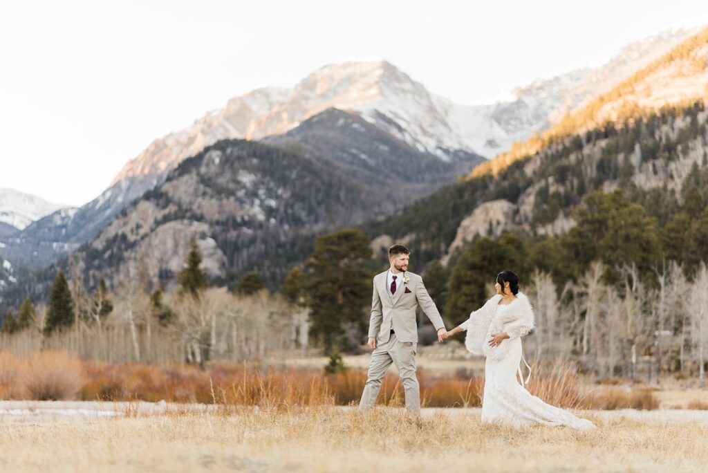 bride and groom walking across field with mountains during small wedding in rocky mountain national park||||||||||||||||||||small wedding at sprague lake in rocky mountain national park||||bride and groom tying the knot during their wedding ceremony in rocky mountain national park||bride and groom hugging after small wedding in rocky mountain national park||||bride and groom sharing their first dance at sprague lake wedding in rmnp||bride and groom sharing first dance during small wedding in rocky mountain national park||||||groom twirling bride at sprague lake in rocky mountain national park|bride and groom popping champagne during rocky mountain national park wedding|||||||bride and groom walking in rocky mountain national park after their wedding||bride and groom holding hands looking opposite directions during small wedding in rocky mountain national park|
