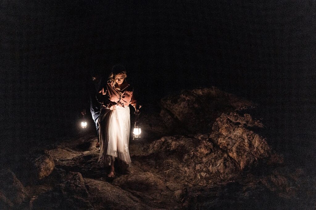 blue hour photo with wedding couple holding lanterns during Estes Park elopement